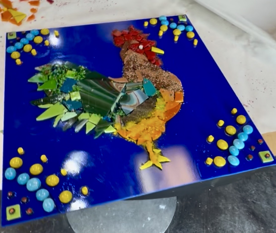 Glass fusing rooster project on a cobalt blue base made at Paint Fusion Park City