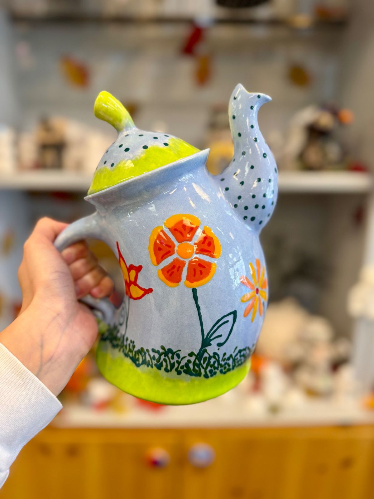 Colorful hand-painted flower teapot with a bird-shaped spout