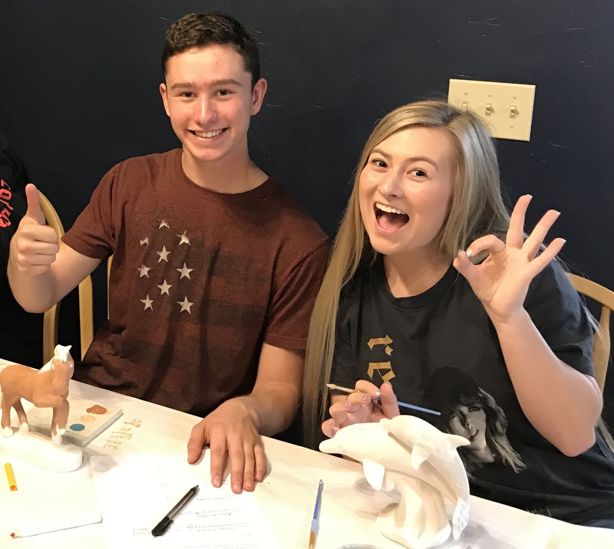 Two guests enjoying an evening painting session at Paint Fusion Park City
